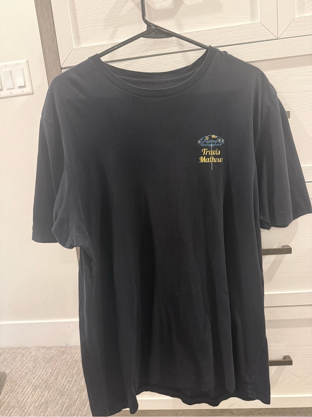 Travis Mathew Black Short-Sleeve Tee with Yellow Logo